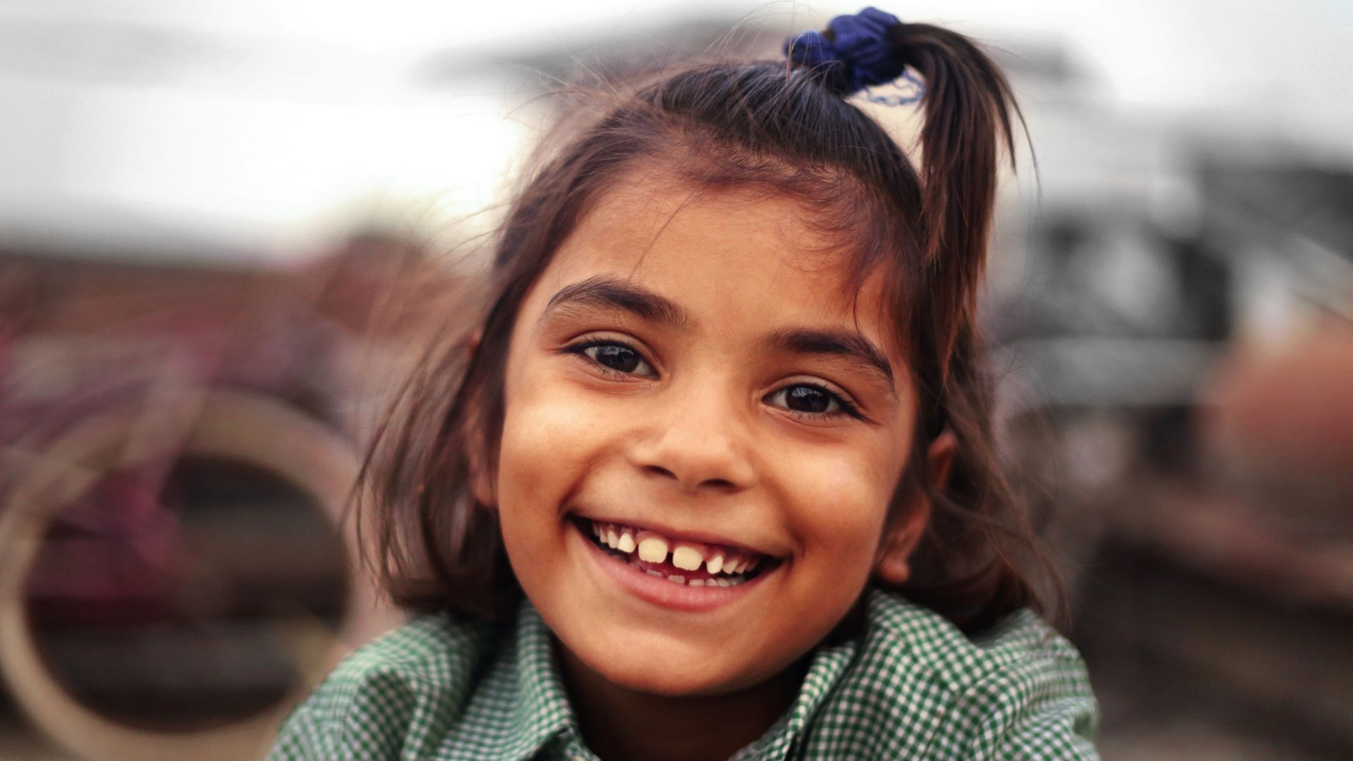 Close up portrait of a cheerful little girl laughing